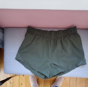 Olive Green Athletic Shorts with Wide Elastic Waistband and Flared Leg Openings